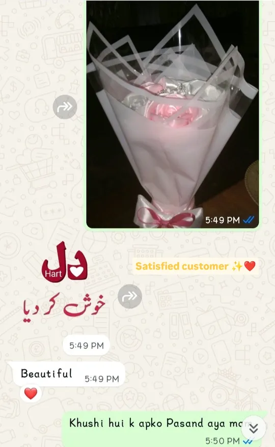 WhatsApp chat: Flora sends a photo of a pink satin rose bouquet with a tiara and the customer replies Beautiful