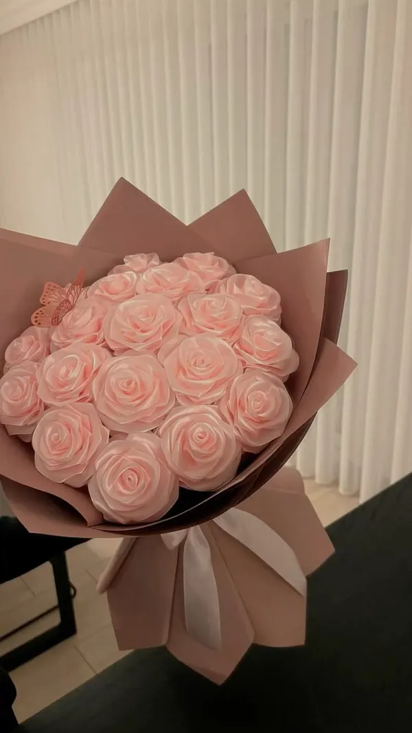 Pale pink satin rose bouquet in dusty rose wrap