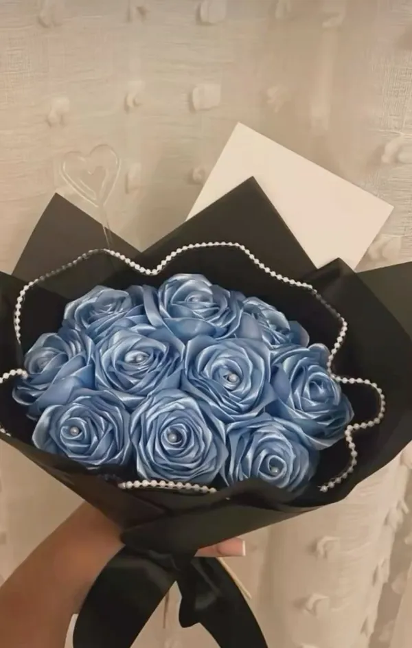 Blue satin roses with a pearl string in black wrap