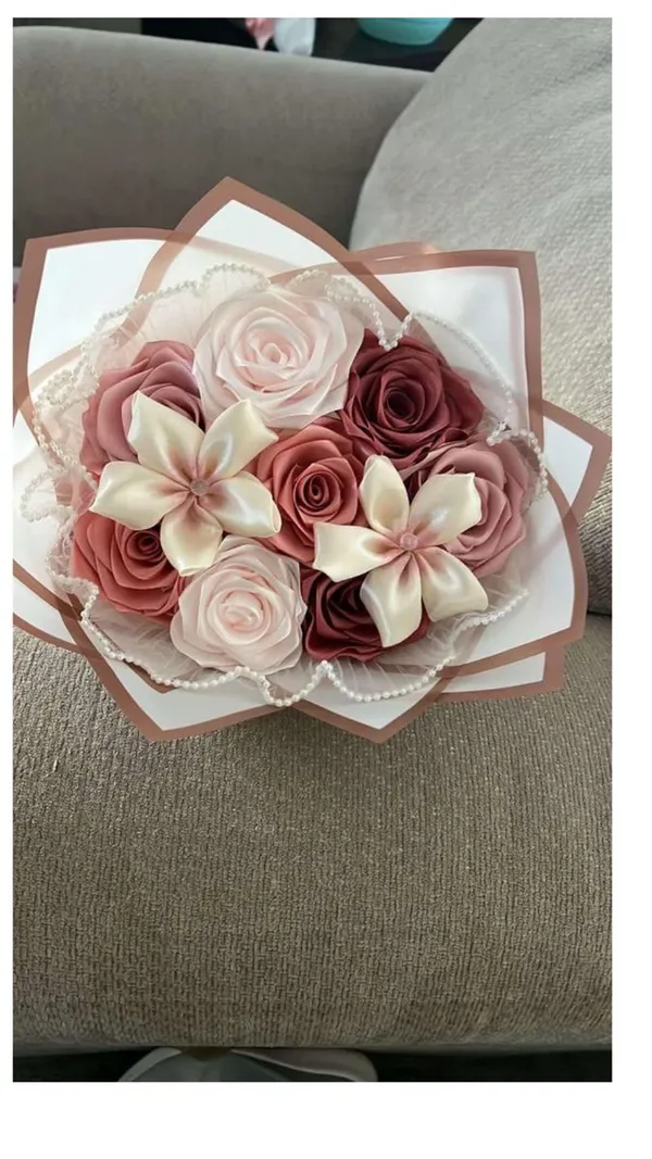 Mauve and blush satin roses mixed with ivory satin lilies